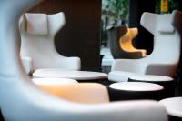 a row of white chairs sitting next to each other at Olivia Balmes Hotel in Barcelona