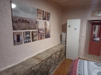 a bedroom with a wall with pictures on the wall at L&#39;Armandière, maison de caractère où règne calme et sérénité. in Pézenes-les-Mines