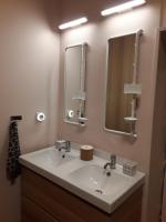 a bathroom with a sink and a mirror at L&#39;Armandière, maison de caractère où règne calme et sérénité. in Pézenes-les-Mines