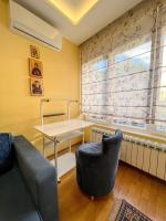 a living room with a couch and a table at Mega Lux Apartment in Vračar (historical)