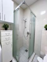 a bathroom with a shower with a glass shower stall at Mega Lux Apartment in Vračar (historical)