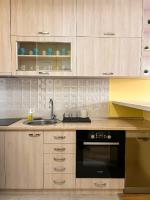 a kitchen with a sink and a stove at Mega Lux Apartment in Vračar (historical)