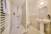 a bathroom with a shower and a sink and a toilet at NOCNOC - Le Zellige - Petite piscine et jardin en ville in Montpellier
