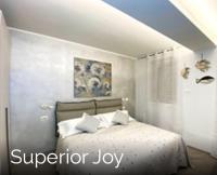A bed or beds in a room at Blue House Varenna