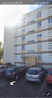 a parking lot with cars parked in front of a building at Logement entier : appartement - Brest in Brest