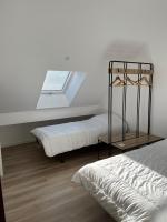 a bedroom with two beds and a window at Le Sailhet, maison de vacances in Pierrefitte-Nestalas