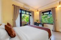 Ein Bett oder Betten in einem Zimmer der Unterkunft Loc Phat Hoi An Homestay