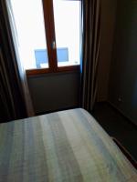 A bed or beds in a room at Uniclub House