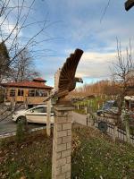 a statue of a bird on a brick pillar at VILLA M Slatina Banja Luka 