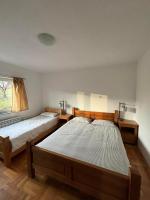 a bedroom with two beds and a window at VILLA M Slatina Banja Luka 