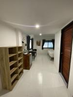 a room with a kitchen and a living room at Samui Green Hotel in Chaweng
