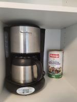 a coffeemaker with a coffee pot and a can in a refrigerator at Studio 5min aéroport d&#39;Orly 2 lits in Athis-Mons