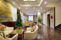 a living room with a christmas tree and a lobby at Atisha Hotel in Kathmandu