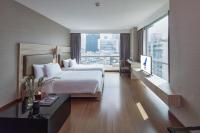 Postel nebo postele na pokoji v ubytování Adelphi Suites Bangkok