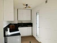 a kitchen with white cabinets and a ceiling fan at 4PA72 - Magnifique appartement pour 4 dans résidence avec piscine et parking in Collioure