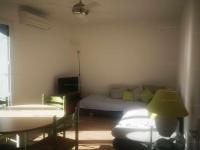 a living room with a couch and a bed at 4PA72 - Magnifique appartement pour 4 dans résidence avec piscine et parking in Collioure