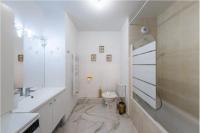 a white bathroom with a sink and a toilet at Disney best location &amp; confortable 4 beds - All by feet in Serris