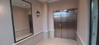 a walk in shower in a bathroom with a mirror at Disney best location &amp; confortable 4 beds - All by feet in Serris