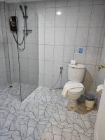 a bathroom with a shower and a toilet at Samui Green Hotel in Chaweng