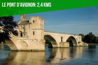 a bridge over the water with a green banner at The Rooftop - AC CLIM - Wi-Fi - Parking gratuit dans la rue in Avignon