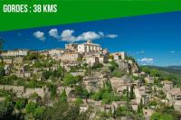 a village on a mountain with a green background at The Rooftop - AC CLIM - Wi-Fi - Parking gratuit dans la rue in Avignon