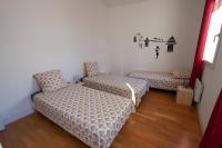 a room with two beds and a couch at CAN MAYRA in Perpignan