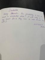 a handwritten note on a white piece of paper at La coccinelle in Noyarey