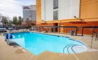 a large swimming pool in front of a building at Hyatt Place Atlanta Airport North in Atlanta