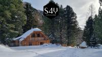 a log cabin in the snow with a sign on it at Alpin-Hütten auf der Turracherhöhe Haus Murmeltier by S4Y in Turracher Hohe