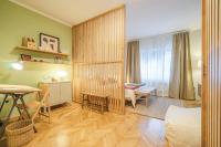 a small room with a bedroom and a dining room at GREENKO Apartment in Zagreb