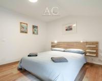A bed or beds in a room at Square Apartment
