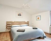 A bed or beds in a room at Square Apartment