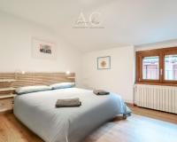 A bed or beds in a room at Square Apartment