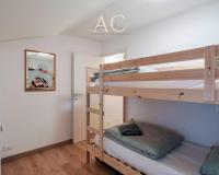 A bed or beds in a room at Square Apartment