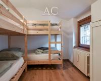 A bed or beds in a room at Square Apartment