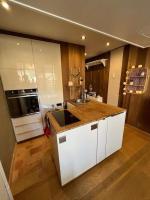 a kitchen with a sink and a counter top at Studio cosy et moderne aux pieds des pistes in LʼHuez