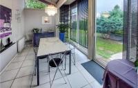 a kitchen with a table and chairs and a window at Beautiful Home In Angresse With Wi-fi in Angresse