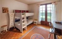a room with a white bunk bed with a desk and a window at Beautiful Home In Angresse With Wi-fi in Angresse