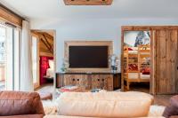 Telewizja i/lub zestaw kina domowego w obiekcie Appartement Thom's - LES GETS, en plein centre et au pied des pistes