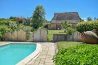 a backyard with a swimming pool and a house at Domaine d&#39;Essendiéras in Saint-Médard-dʼExcideuil