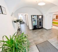 a lobby with a vending machine and a plant at City Rooms Wels - contactless check-in in Wels