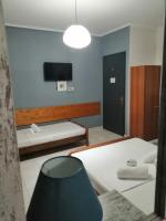 A bed or beds in a room at Hotel Efyra