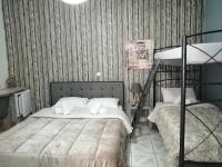 A bed or beds in a room at Hotel Efyra