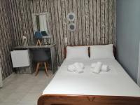 A bed or beds in a room at Hotel Efyra