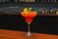 a drink in a glass sitting on a table at Hotel El Cocobolo Food&Rest Room 1 B&B WiFi AC Pkg Free Swimmingpool in Ahogados