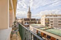 a view from a balcony of a city with a cathedral at Le Lumen — Cocon lumineux en hyper centre in Caen