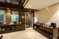 a kitchen with a counter with pots and pans at Eastlynn Resort Rishikesh in Rishīkesh