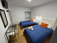 Posteľ alebo postele v izbe v ubytovaní Hostal ARS
