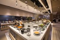 a buffet line in a restaurant with a lot of food at St Giles Southkey in Johor Bahru