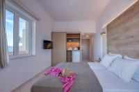Postel nebo postele na pokoji v ubytování Galini Beach Hotel